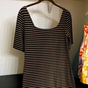 Brown and black form fitting dress with a zippered back.